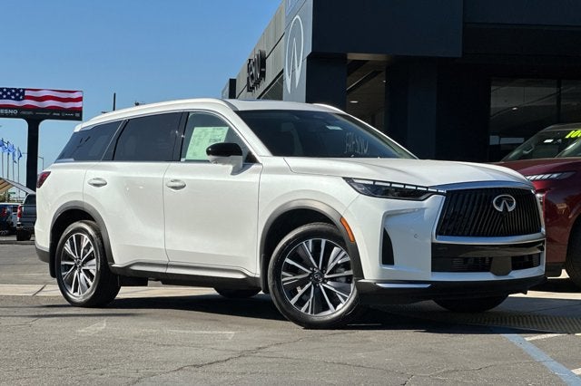 2027 INFINITI QX60 LUXE in Radiant White — front three-quarter view